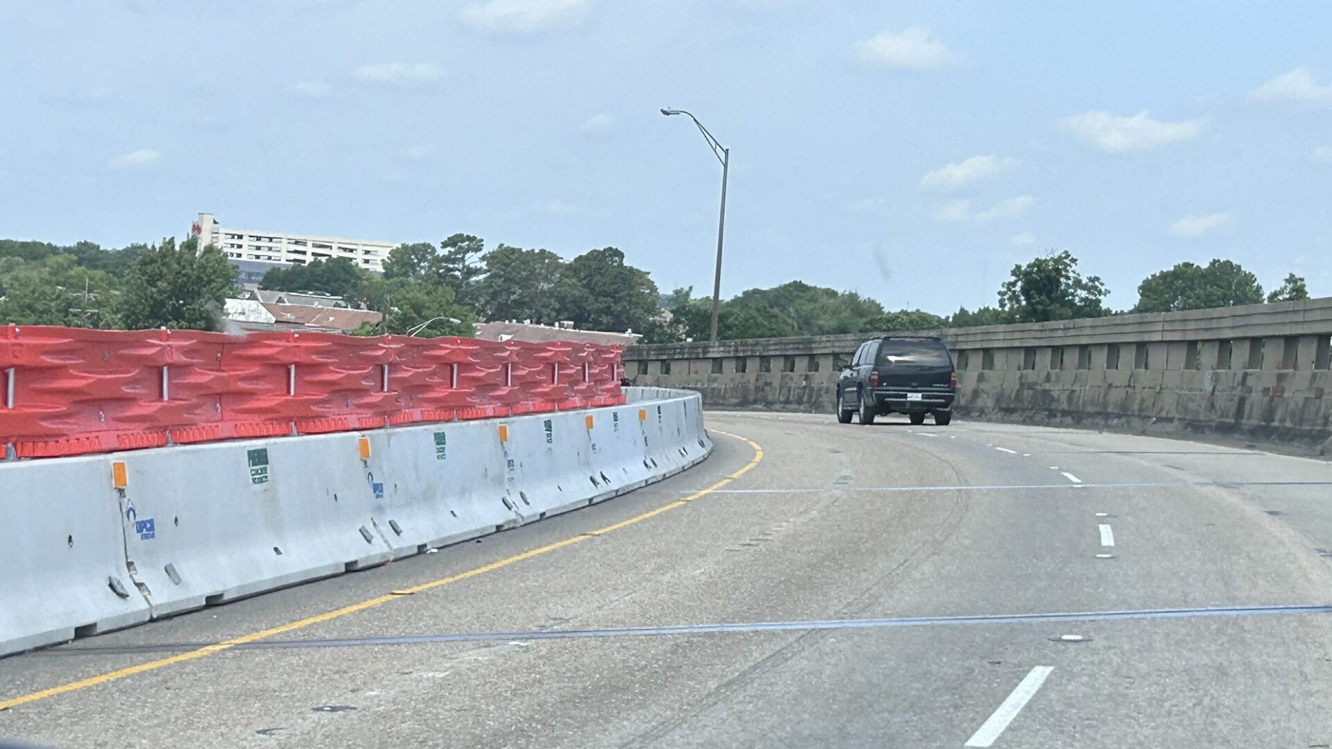 May 2026 photo of temporary barrier along left side of I-10 flyover at I-110