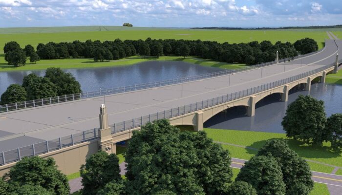 bird's eye view of a proposed I-10 bridge over City Park Lake in Baton Rouge featuring decorative arches, robust columns, and towers at corners